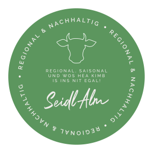Ein rundes Logo zur Nachhaltigkeit auf der Seidlalm, in grün.